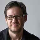 Man with glasses giving testimonial about Tesla energy generator blueprint